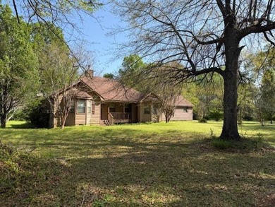 This unique house sits on approximately 3 acres. It has 3