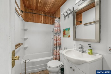 Opportunity knocks in Salem! Situated on a generous .25-acre lot