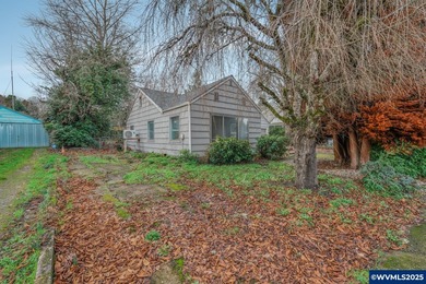 Opportunity knocks in Salem! Situated on a generous .25-acre lot