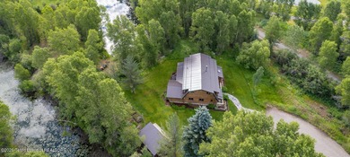 This delightful log home is set on 3.10 acres along Moose-Wilson - photo 2