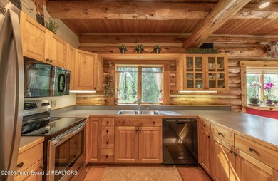 This delightful log home is set on 3.10 acres along Moose-Wilson - photo 6