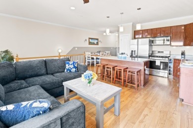 This upscale 3-story townhome has a wonderful water view of