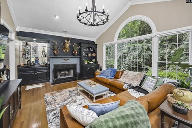 Nestled among nearly two acres of mature old-growth hardwoods in - photo 13