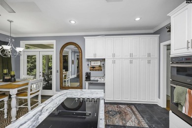 Nestled among nearly two acres of mature old-growth hardwoods in - photo 14