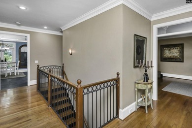 Nestled among nearly two acres of mature old-growth hardwoods in - photo 17