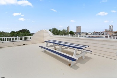 This upscale 3-story townhome has a wonderful water view of