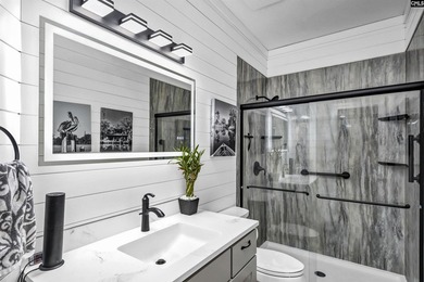 Nestled among nearly two acres of mature old-growth hardwoods in - photo 31