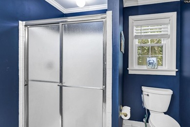 Nestled among nearly two acres of mature old-growth hardwoods in - photo 41