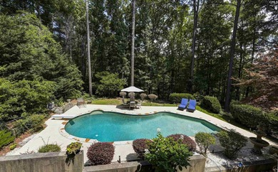 Nestled among nearly two acres of mature old-growth hardwoods in - photo 50