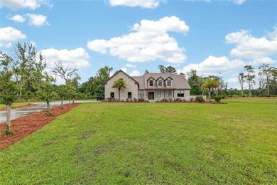 Beautiful brick home situated on nearly 3 acres in the gated - photo 2