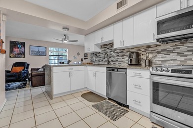 Location is everything! This 3-bedroom, 2-bath condo in Windwood - photo 11
