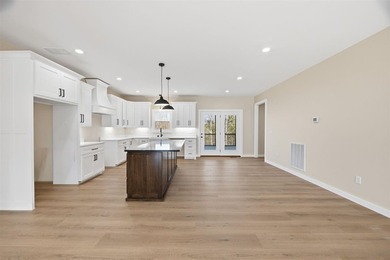 Indulge in 4789 square feet of refined lakefront living, where - photo 8