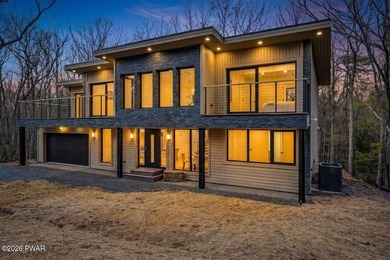 Welcome to a truly exceptional modern retreat nestled in the - photo 3