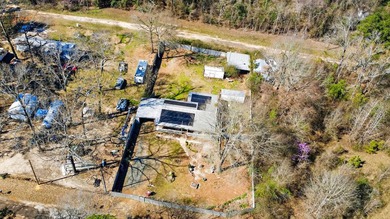 Located in Pine Harbor near Lake O' the Pines, this single-story - photo 3