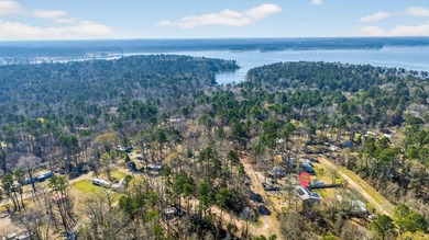 Located in Pine Harbor near Lake O' the Pines, this single-story - photo 4
