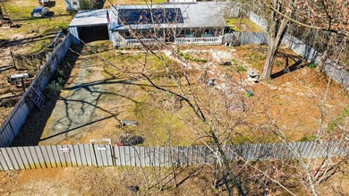 Located in Pine Harbor near Lake O' the Pines, this single-story - photo 5