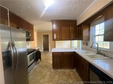 This home features 3 bedrooms and 2 1/2 bathrooms. It includes - photo 8
