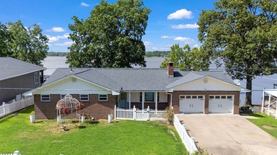 Located on Wolf Creek, this updated waterfront home offers one - photo 1