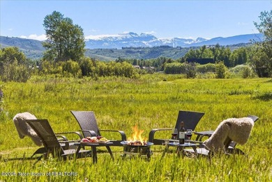 Set on three private acres along Fish Creek Road in Wilson, this - photo 1