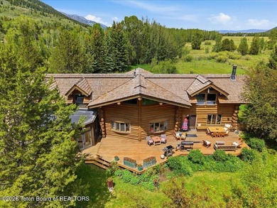 Set on three private acres along Fish Creek Road in Wilson, this - photo 3