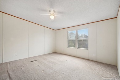 Set on over 1.3 acres in Lakehills, Texas, this 4-bedroom - photo 12