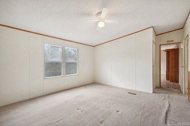 Set on over 1.3 acres in Lakehills, Texas, this 4-bedroom - photo 14