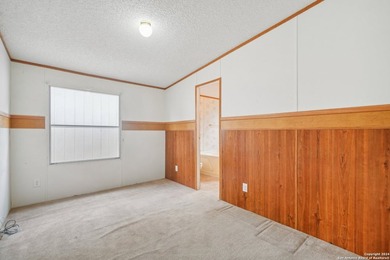 Set on over 1.3 acres in Lakehills, Texas, this 4-bedroom - photo 17