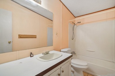 Set on over 1.3 acres in Lakehills, Texas, this 4-bedroom - photo 19