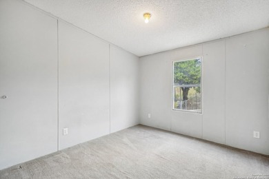 Set on over 1.3 acres in Lakehills, Texas, this 4-bedroom - photo 20