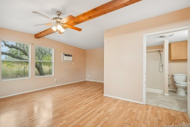 Set on over 1.3 acres in Lakehills, Texas, this 4-bedroom - photo 24