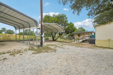 Set on over 1.3 acres in Lakehills, Texas, this 4-bedroom - photo 27