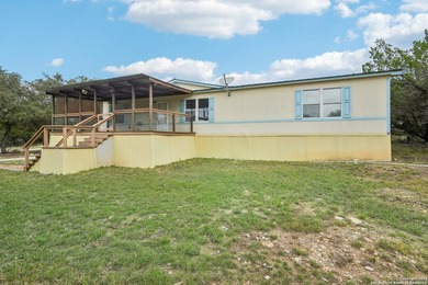 Set on over 1.3 acres in Lakehills, Texas, this 4-bedroom - photo 28