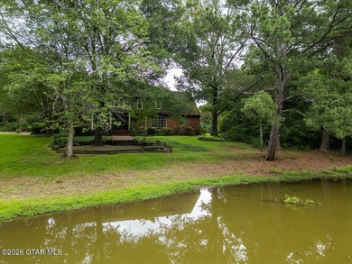Set on 4.04 acres with pond frontage, this custom-built - photo 7
