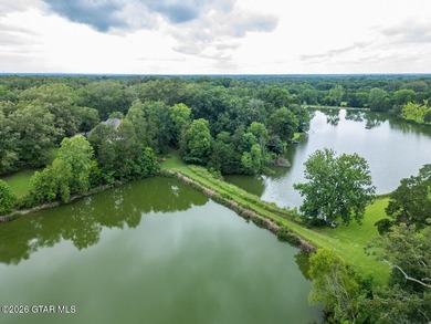 Set on 4.04 acres with pond frontage, this custom-built - photo 9