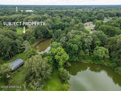 Set on 4.04 acres with pond frontage, this custom-built - photo 10