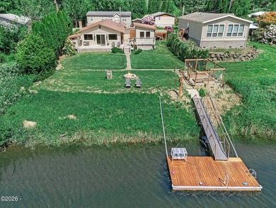 Experience the best of riverfront living in this charming - photo 1