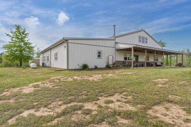 This place has it all. Approx 5500 sq ft of heated space with a - Lake Home For Sale in Eatonton, Georgia