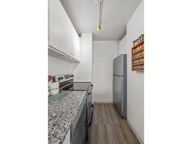 Move-in ready and beautifully updated, this River Towers condo - photo 35