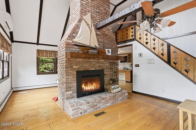 A massive floor-to-ceiling brick fireplace, rumored to contain 3 - photo 7