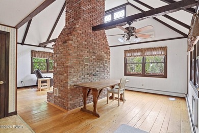 A massive floor-to-ceiling brick fireplace, rumored to contain 3 - photo 8