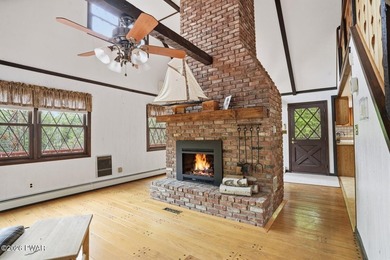 A massive floor-to-ceiling brick fireplace, rumored to contain 3 - photo 9
