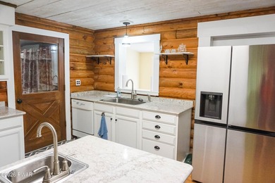 LARGE LOG HOME NESTLED IN A HIGHLY DESIRABLE COMMUNITY JUST - photo 8