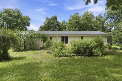 Just minutes from Stockton Lake, this move-in ready home sits on - photo 33