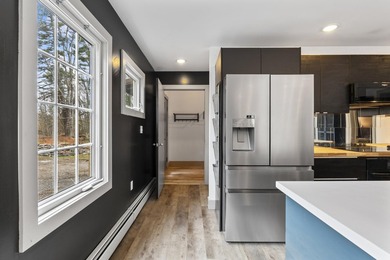 variety of lifestyles. The bright, inviting kitchen and - photo 7