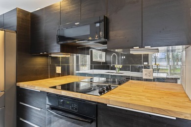 variety of lifestyles. The bright, inviting kitchen and - photo 8