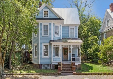 Triplex offering three apartments in this three level home. The - photo 1