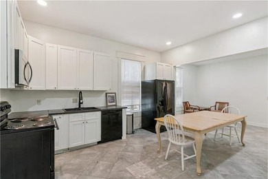 Triplex offering three apartments in this three level home. The - photo 6
