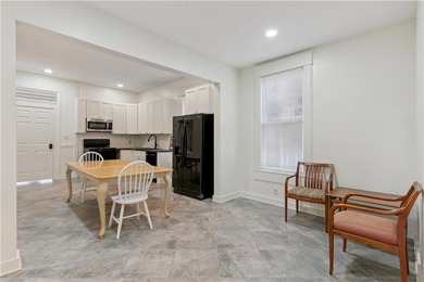 Triplex offering three apartments in this three level home. The - photo 7