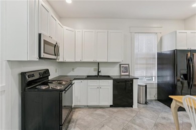 Triplex offering three apartments in this three level home. The - photo 8