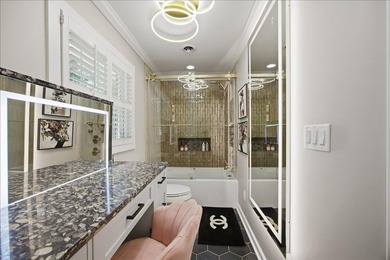 Tucked away on a quiet cul-de-sac in the gated community of the - photo 22